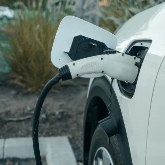 Should I Charge My Electric Car at Home or in Public Charging Stations? Image