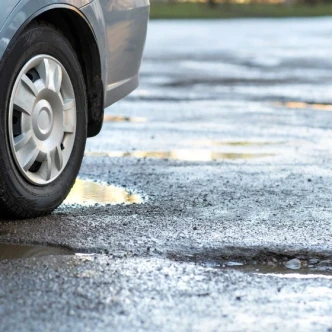 Electric Vehicles and Potholes: Are They More Vulnerable?